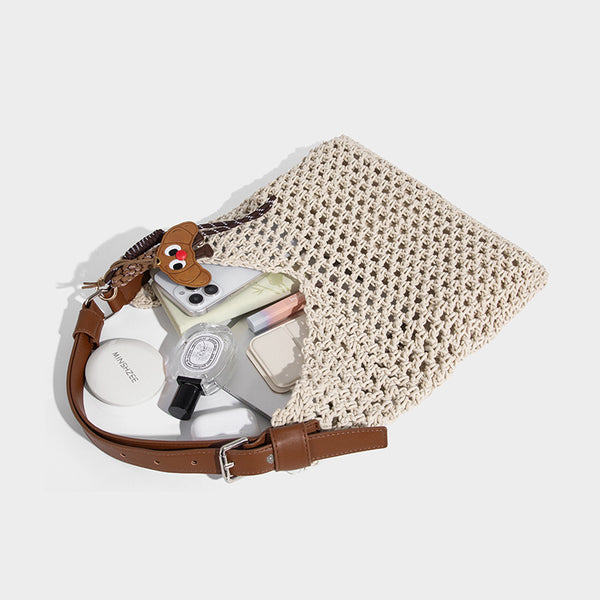 Slouchy open-knit crochet hobo tote bag with leather-look top handle and metal buckle hardware, detail view 4