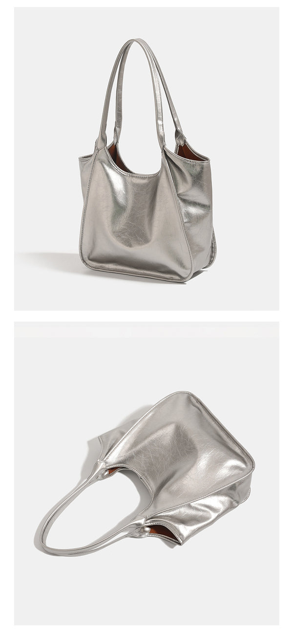 Large open-top shoulder tote bag with glossy crinkled metallic finish and long double straps, detail view 11