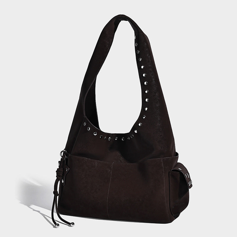 Slouchy hobo shoulder bag in dark brown matte suede-look finish with silver-tone stud-trimmed strap and drawstring side