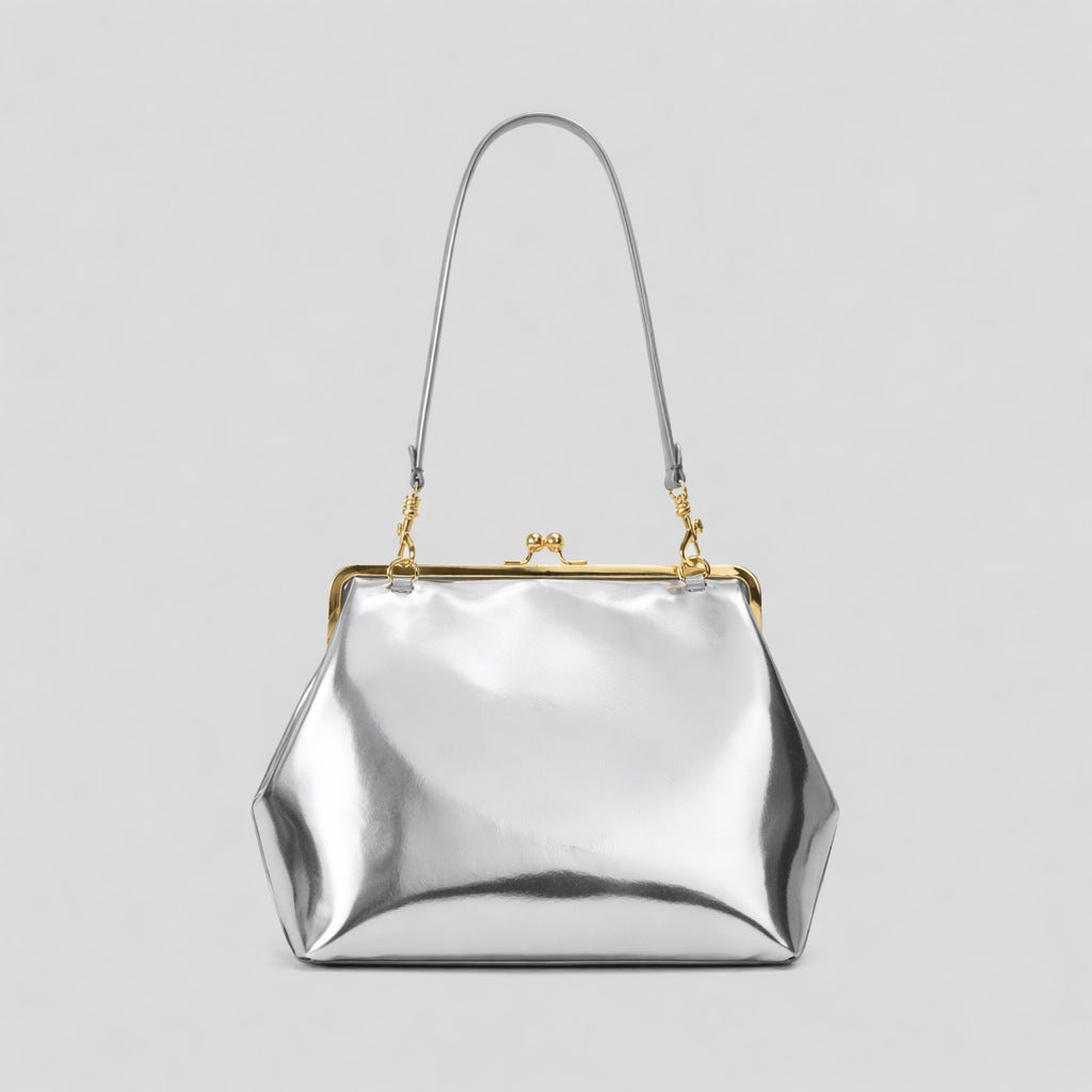 Oversized kiss-lock frame handbag with gold-tone metal clasp and smooth leather-look finish, detail view 11