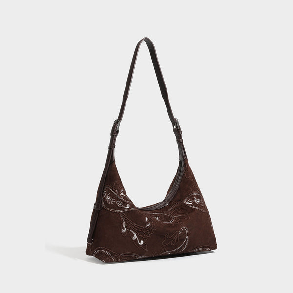 Deep chocolate suede-look hobo shoulder bag with tonal paisley floral embroidery, smooth dark leather-look trim, top zip
