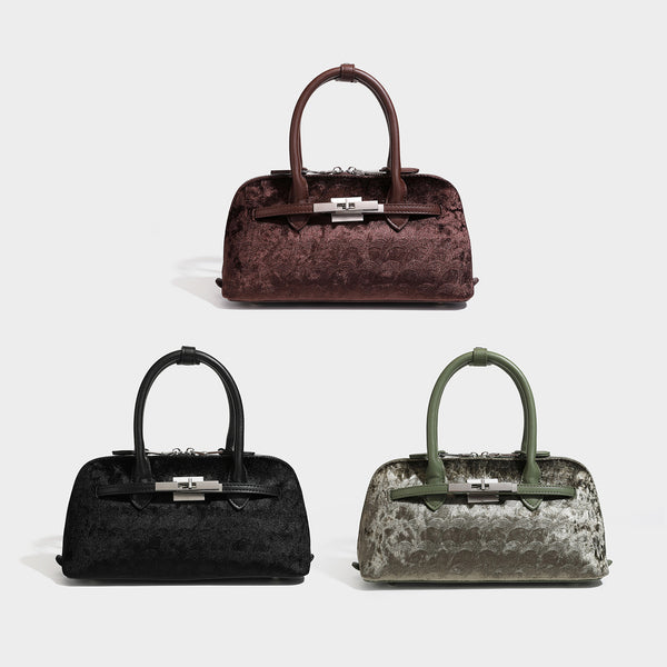 Small structured satchel bag in dark brown velvet-like textured finish with leather-look trim, silver-tone turn-lock bar