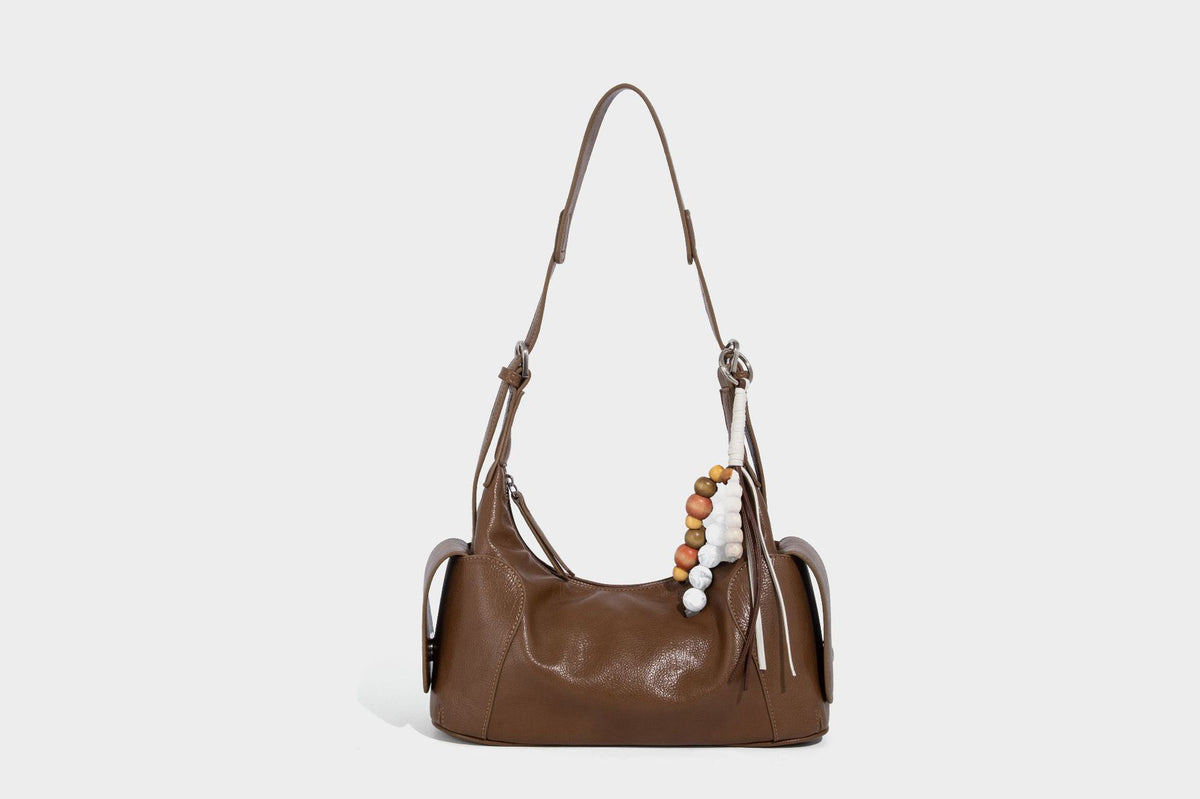 Soft pebbled leather-look hobo shoulder bag with zip top closure, side flap pockets, and silver-tone hardware, detail view 27