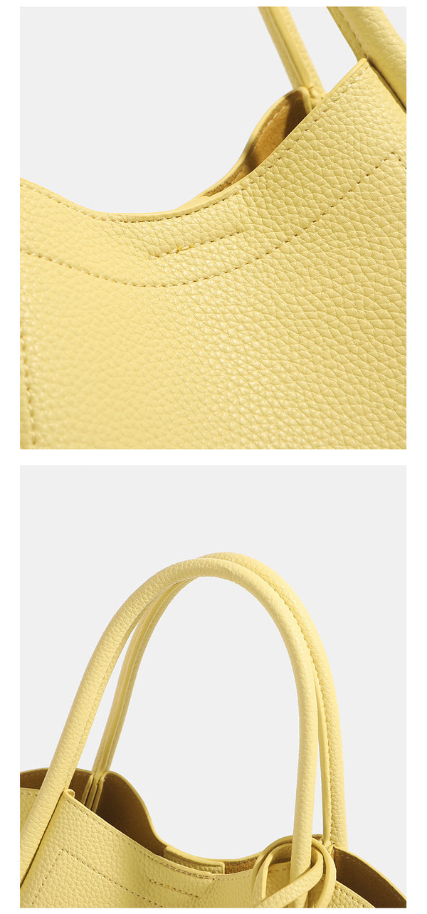 Small structured pebbled leather-look bucket tote bag with bow charm tie closure and gold-tone hardware, detail view 15