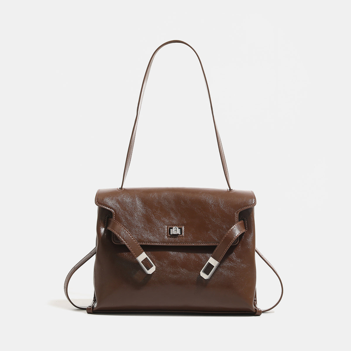 Structured rectangular flap shoulder bag in glossy leather-look finish with silver turn-lock clasp and adjustable strap