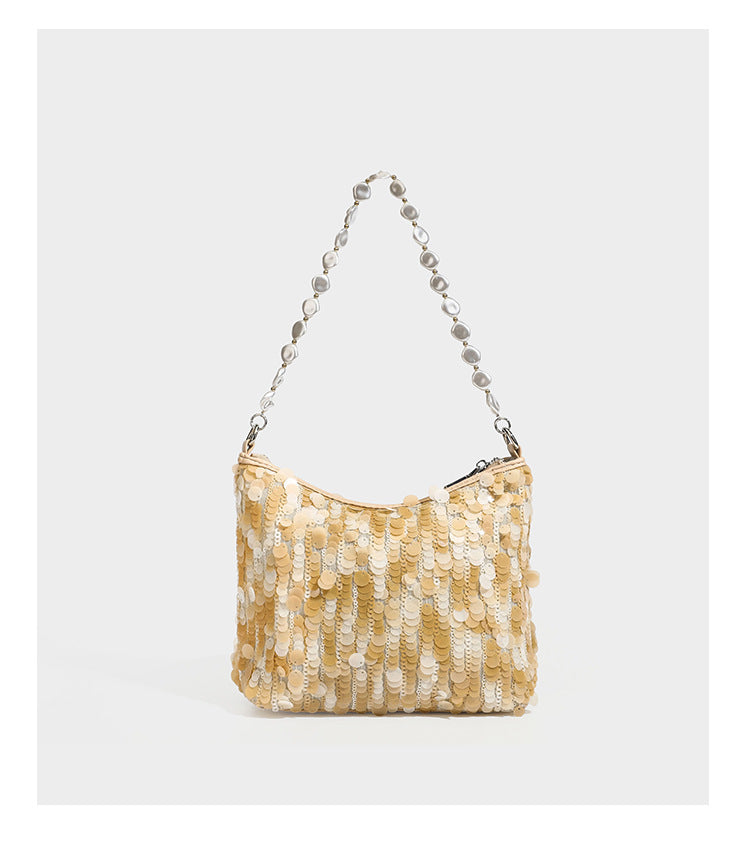 Champagne and ivory large-disc sequin shoulder bag with baroque faux-pearl beaded chain strap and silver-tone zip closure