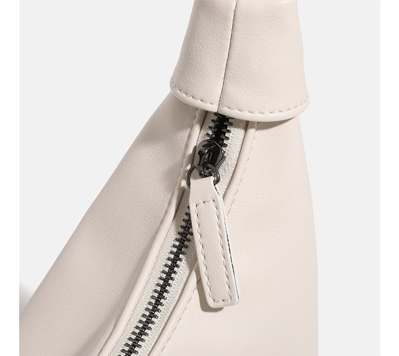 Slouchy leather-look hobo bag with knotted loop handle and top zipper closure, detail view 18