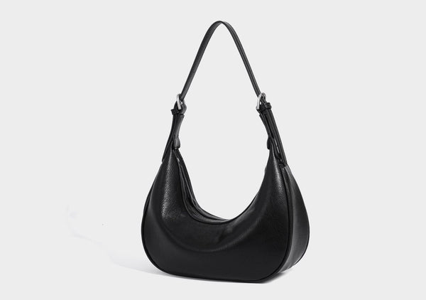 Crescent half-moon shoulder bag in pebbled leather-look finish with adjustable strap and silver-tone hardware, detail view 19