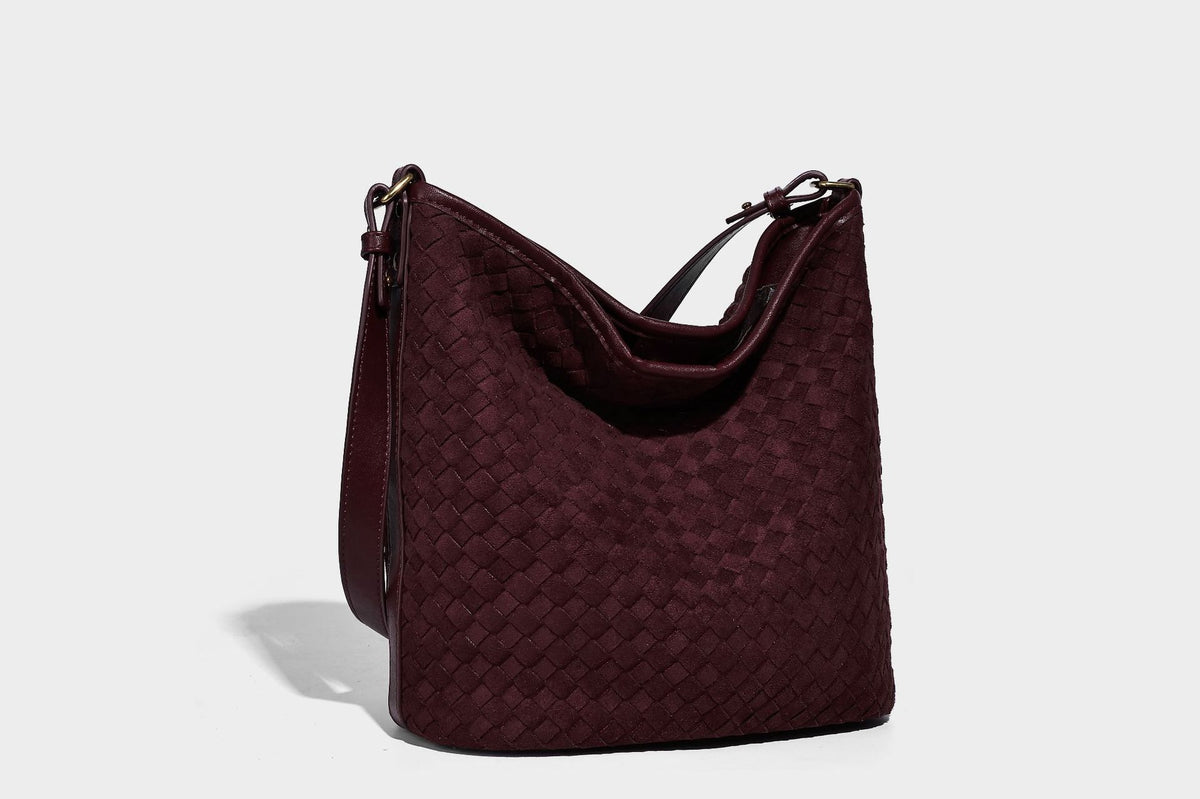 Dark chocolate woven texture hobo shoulder bag with multicolor tassel-and-bead charm and long adjustable strap, detail view
