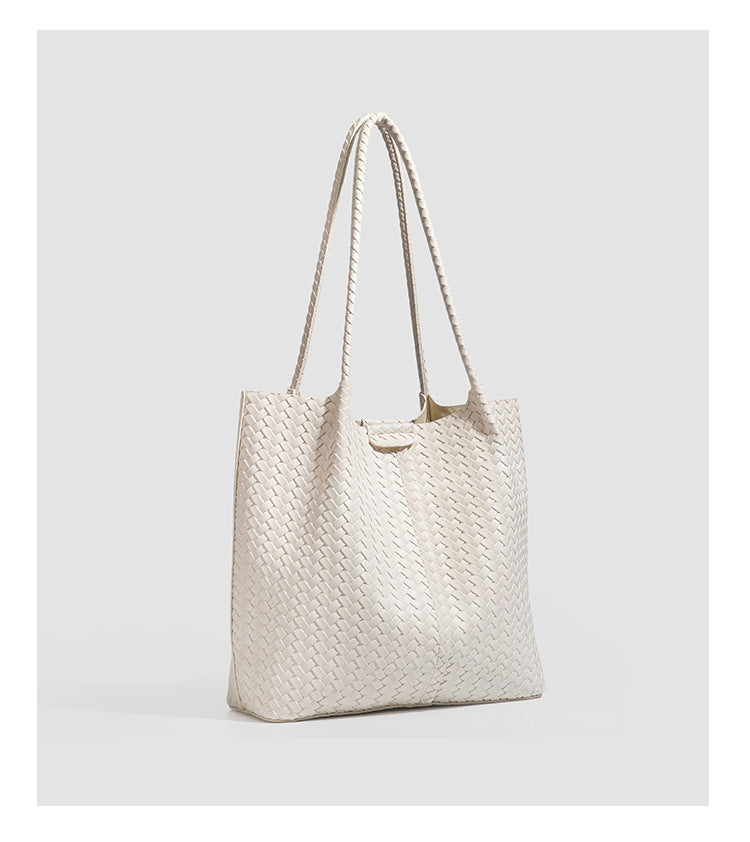 Large black basket-weave leather-look tote bag with long braided shoulder straps and matching woven zip pouch, detail view 19