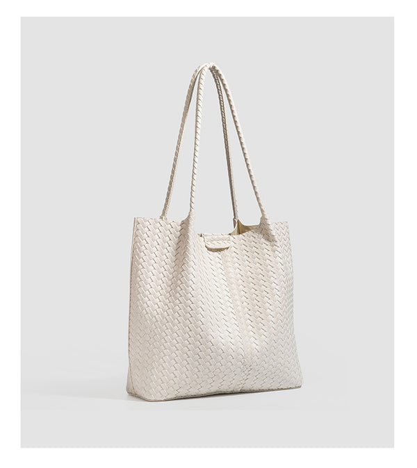 Large black basket-weave leather-look tote bag with long braided shoulder straps and matching woven zip pouch, detail view 19