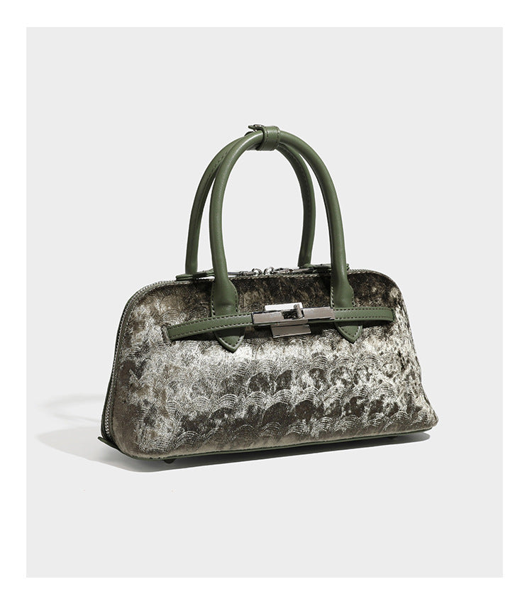 Small structured satchel bag in dark brown velvet-like textured finish with leather-look trim, silver-tone turn-lock bar