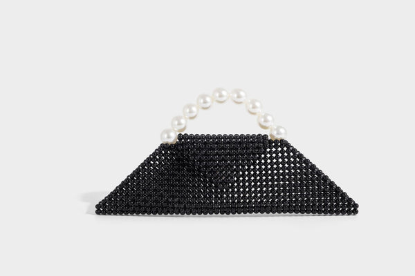 Small structured triangle clutch bag covered in glossy pearl beads with an arched pearl top handle and silver snap closure