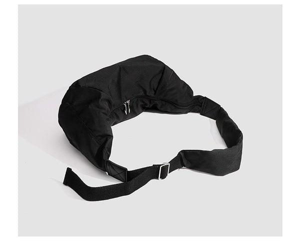 Large crescent sling shoulder bag in gathered fabric with zip closure and adjustable strap, detail view 14