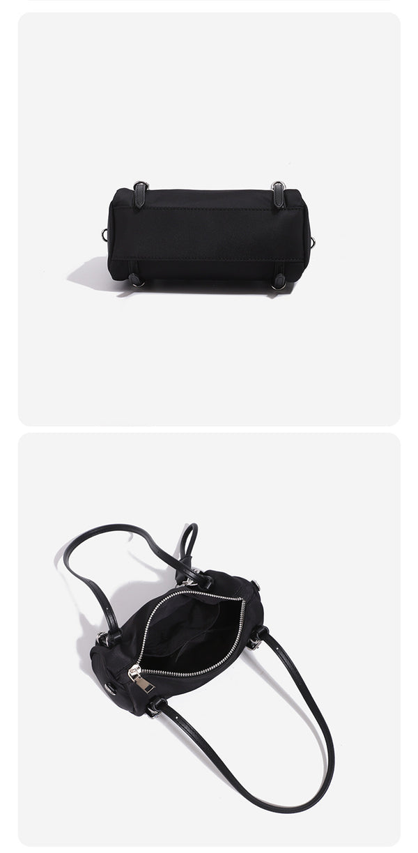 Compact nylon Boston barrel bag with zip-top closure, silver-tone hardware, dual slim handles, and detachable crossbody