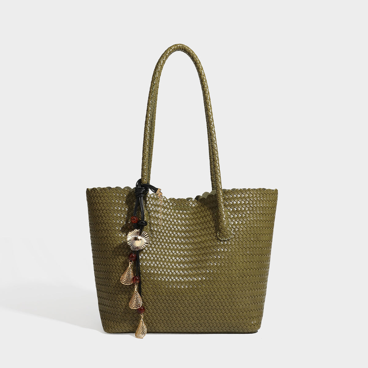 Large open-top woven leather-look tote bag in dark brown with scalloped edge, braided double shoulder straps, and decorative