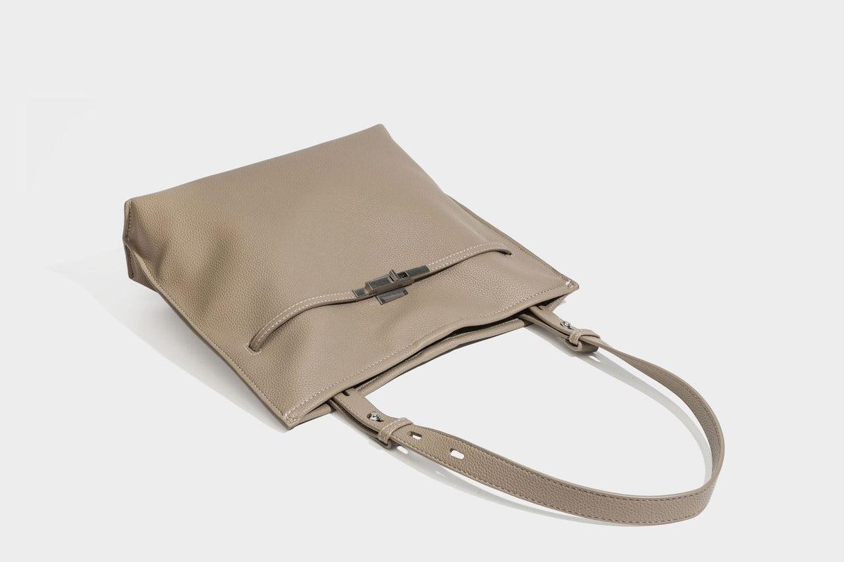 Pebbled leather-look tote bag with front toggle hardware and long shoulder strap, detail view 27