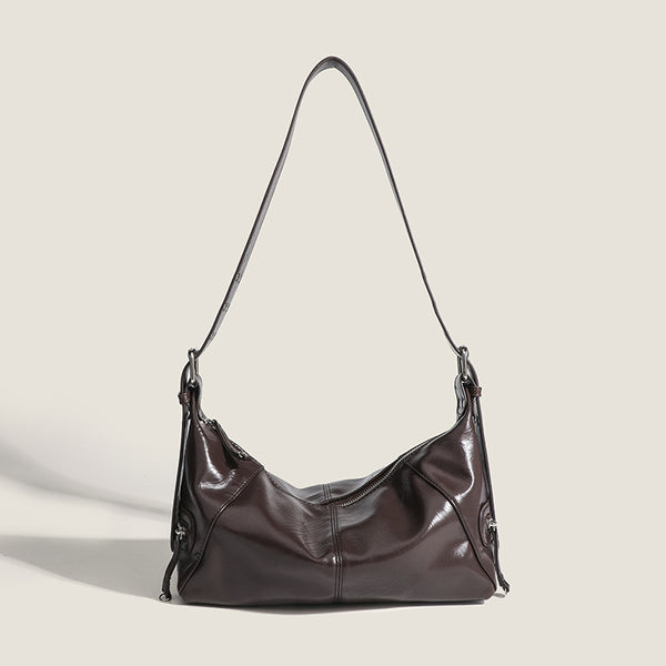 Glossy crinkled mini hobo shoulder bag with studded adjustable strap and silver-tone hardware, detail view 8