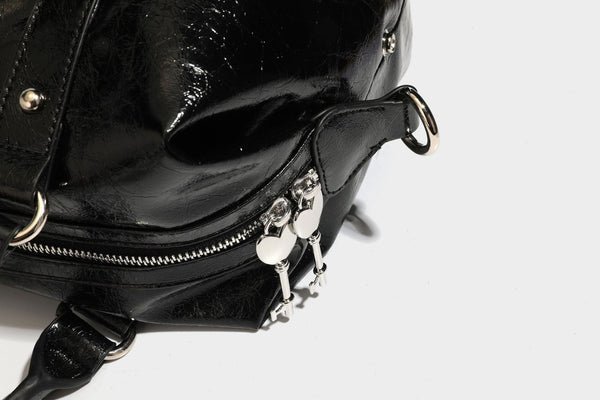 Glossy crinkled barrel handbag with silver stud buckle strap and detachable shoulder strap, detail view 35