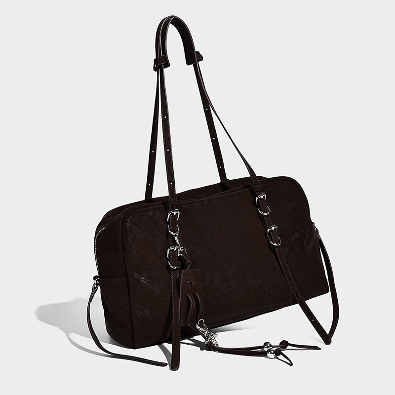 Structured rectangular matte suede-like shoulder bag with silver-tone hardware, zip closure, double top handles, and, front