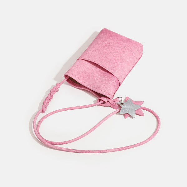 Small vertical textured mini crossbody phone bag with long braided cord strap and silver-toned star charm, detail view 4