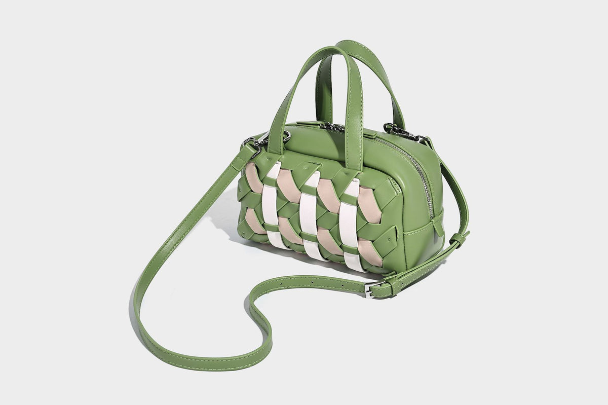 Small structured satchel bag with two-tone woven front panel, dual top handles, and detachable crossbody strap in tan brown
