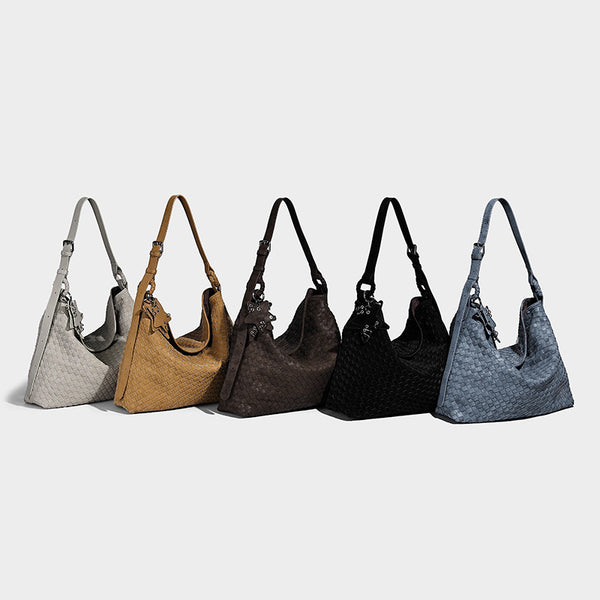 Large soft woven hobo shoulder bag with matte textured finish, adjustable strap, and star charm hardware, detail view 2