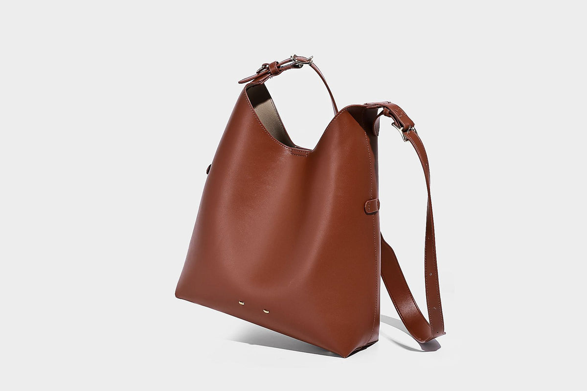 Large open-top hobo shoulder bag in tan leather-look finish with detachable zip pouch and adjustable buckle strap, detail