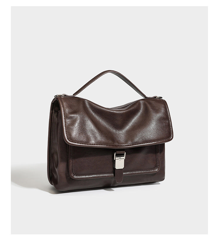 Structured rectangular flap satchel in espresso brown leather-look finish with silver-tone turn-lock buckle, top handle, and