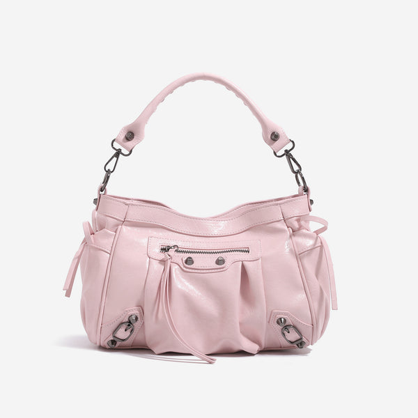 Glossy ruched leather-look shoulder bag with silver stud hardware, fringe trim, front zip pocket, and top handle, detail view