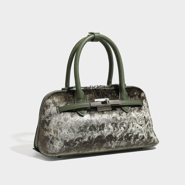 Small structured satchel bag in dark brown velvet-like textured finish with leather-look trim, silver-tone turn-lock bar