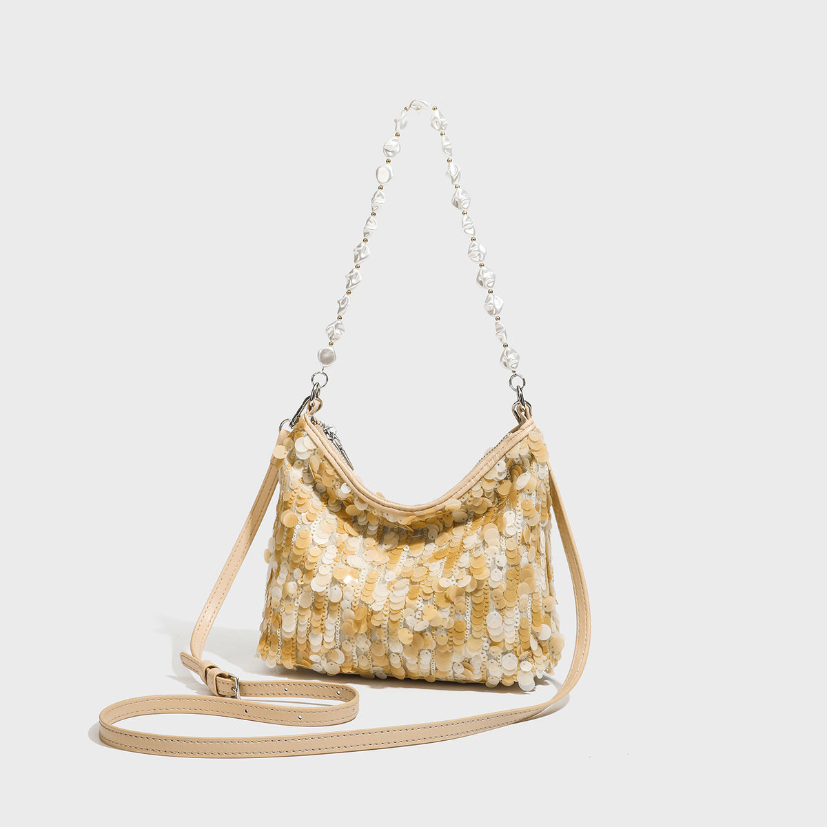 Small crescent sequin shoulder bag with pearl beaded strap and zip closure, front view
