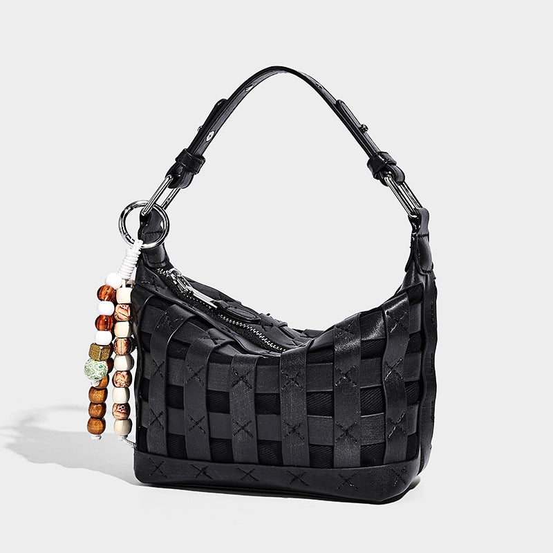Small woven convertible shoulder bag with top zipper, silver-tone hardware, and detachable crossbody strap, detail view 4