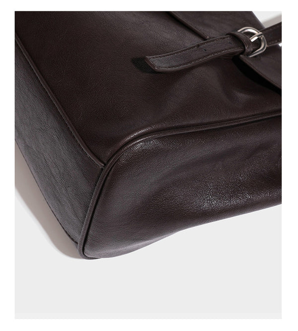 Large structured vintage-style tote bag with flap-front turn-lock closure, twin buckle straps, and double shoulder handles