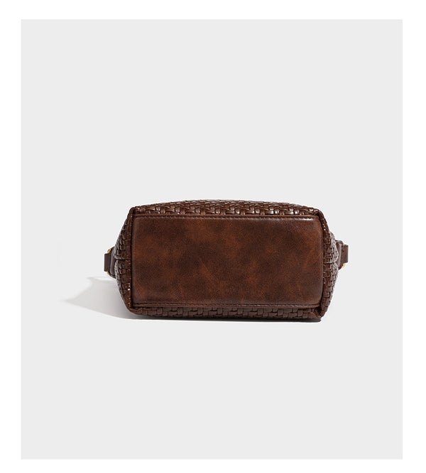 Small glossy basket-weave hobo shoulder bag in brown with knotted top handle, flap accent pocket, and gold-tone hardware