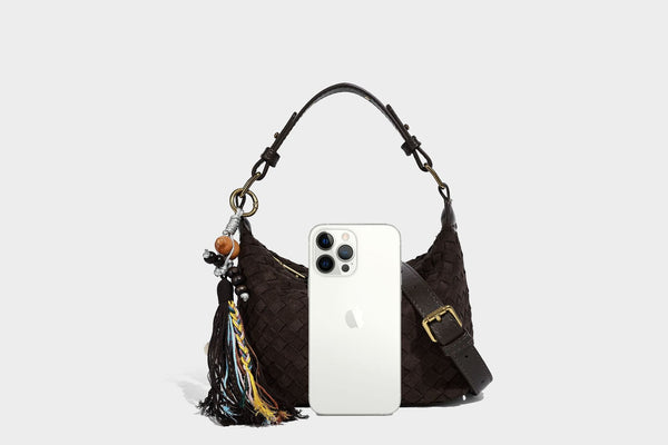Small woven-texture crescent hobo bag in dark chocolate brown with top zip closure, gold-tone hardware, and adjustable