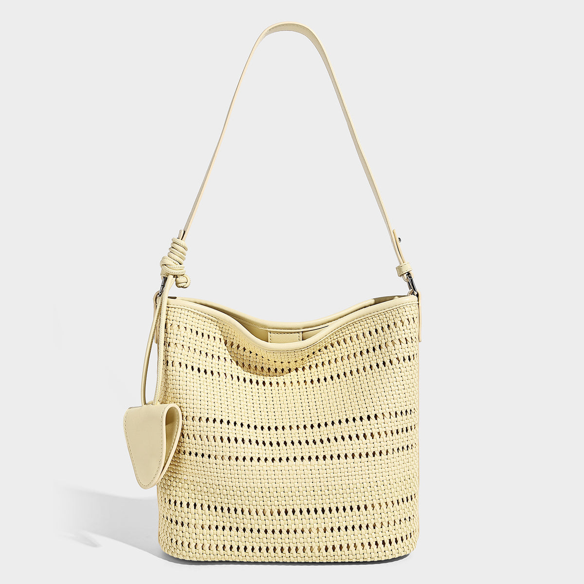 Handwoven open-weave shoulder bag with leather-look trim, knotted adjustable strap, and clip-on sunglasses sleeve pouch