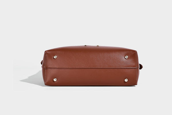 Large open-top hobo shoulder bag in tan leather-look finish with detachable zip pouch and adjustable buckle strap, detail
