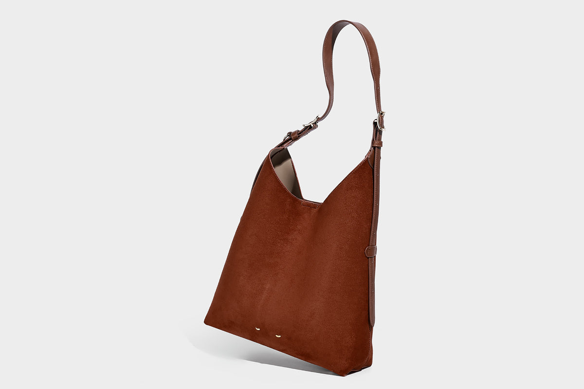 Large open-top hobo shoulder bag in tan leather-look finish with detachable zip pouch and adjustable buckle strap, detail