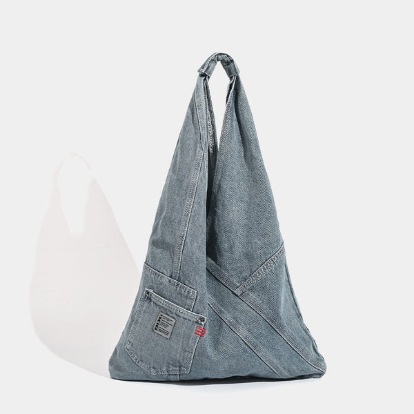 Washed denim slouch tote bag with patch pocket and contrast stitching, detail view 6