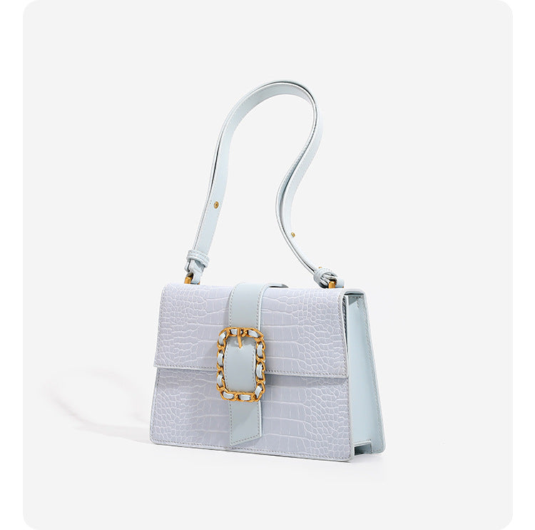 Structured crocodile-embossed flap shoulder bag with gold chain buckle hardware and adjustable strap, detail view 9