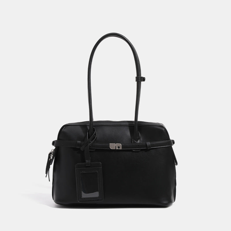 Structured leather-look zip-top tote satchel with twin handles, front turn-lock strap, hanging ID tag, and silver-tone