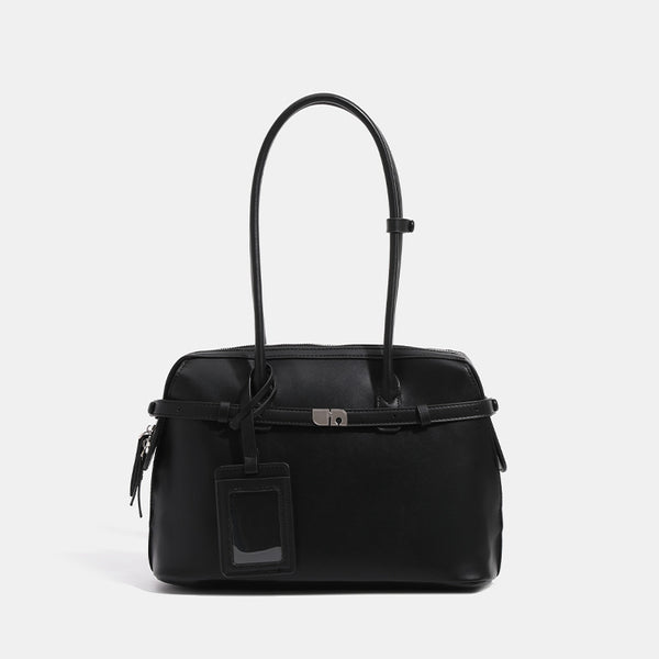 Structured leather-look zip-top tote satchel with twin handles, front turn-lock strap, hanging ID tag, and silver-tone