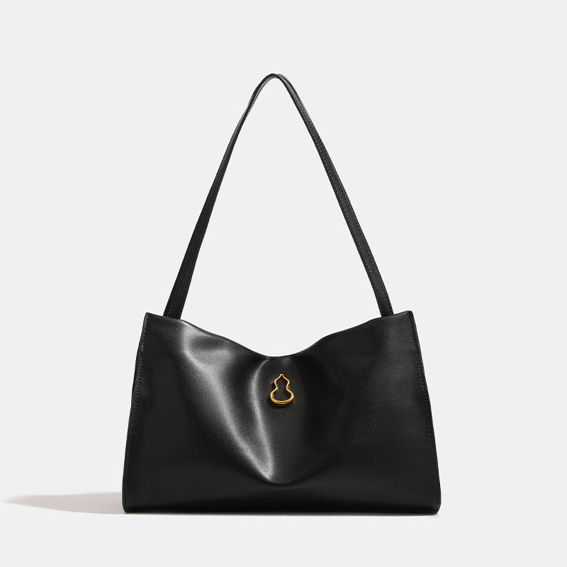 Smooth leather-look slouchy trapezoid shoulder tote with gold-tone gourd clasp hardware and long slim straps, detail view 6