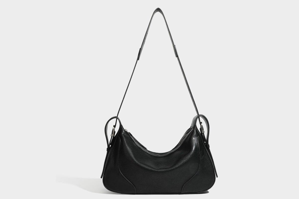 Slouchy crescent hobo shoulder bag in dark brown pebbled leather-look finish with zip top and long shoulder strap, detail