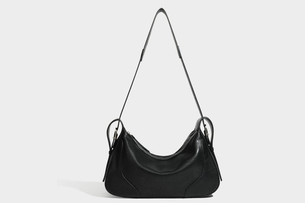 Slouchy crescent hobo shoulder bag in dark brown pebbled leather-look finish with zip top and long shoulder strap, detail
