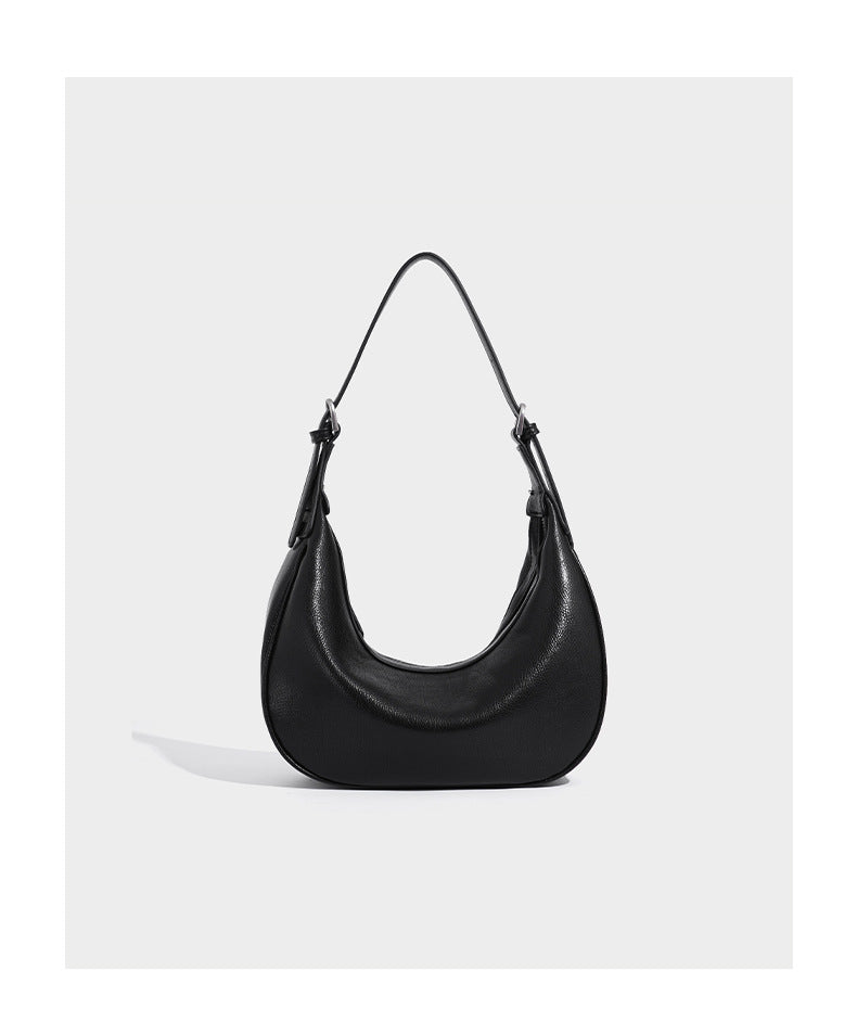 Crescent half-moon shoulder bag in pebbled leather-look finish with adjustable strap and silver-tone hardware, detail view 10
