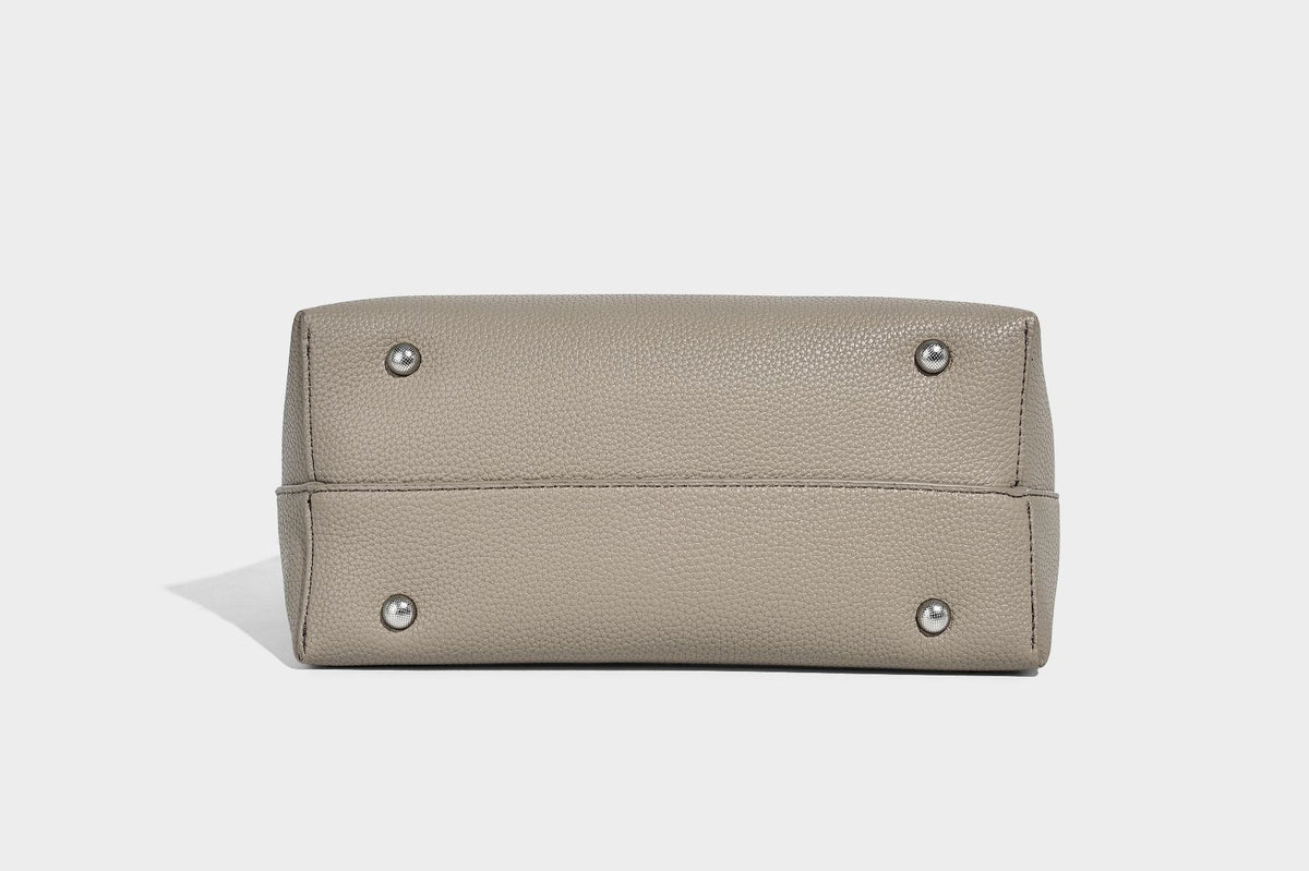 Soft slouchy hobo shoulder bag in pebbled matte finish with slim strap, silver-tone ring hardware, and knotted printed scarf