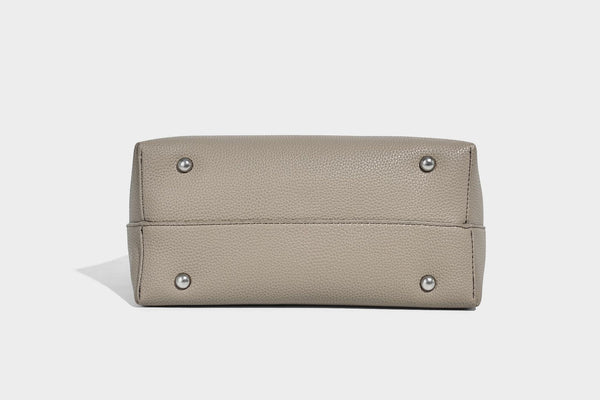 Soft slouchy hobo shoulder bag in pebbled matte finish with slim strap, silver-tone ring hardware, and knotted printed scarf
