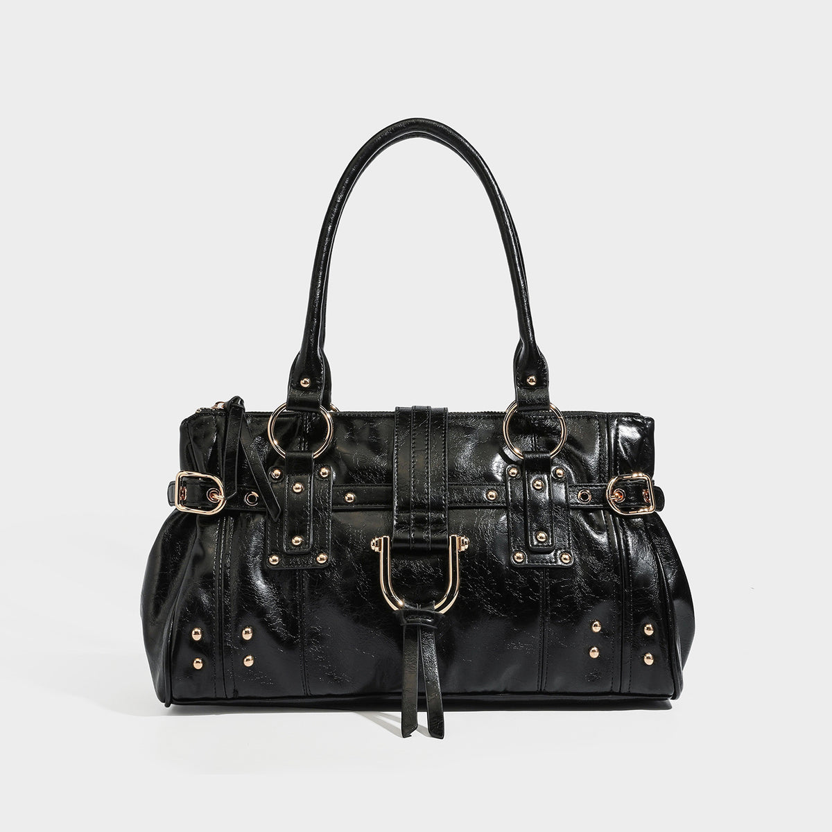 Dark brown glossy leather-look structured satchel tote with gold-tone studs, buckle straps, dual top handles, and detachable